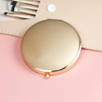 Compact mirror with rose gold frame 
