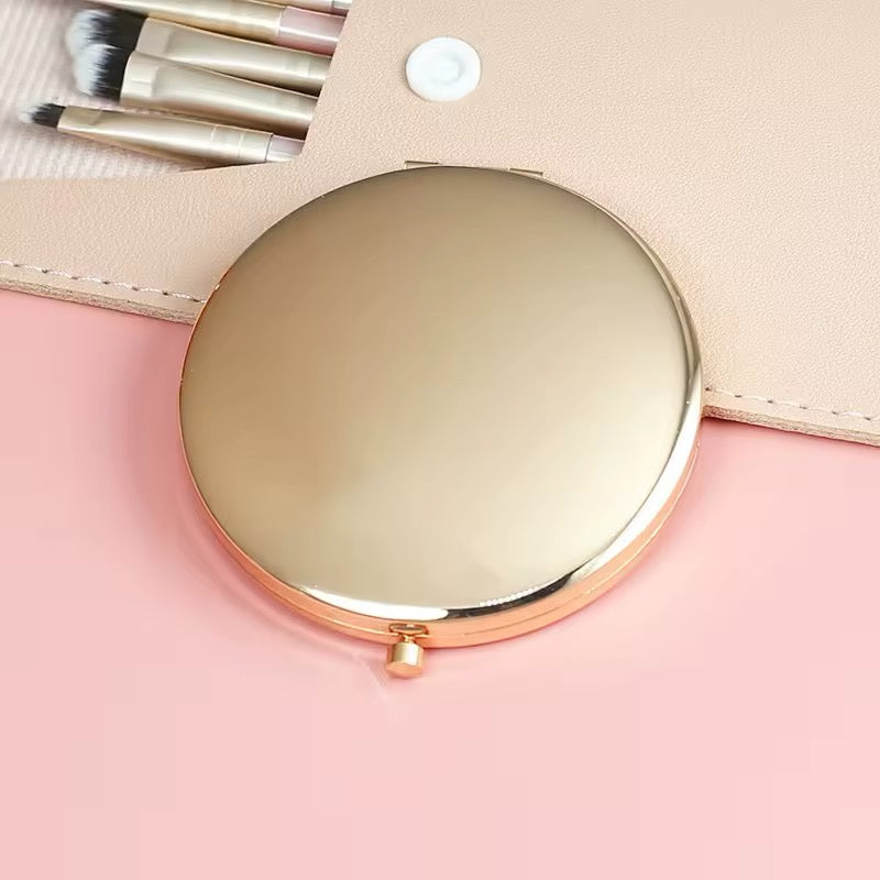 Compact mirror with rose gold frame 
